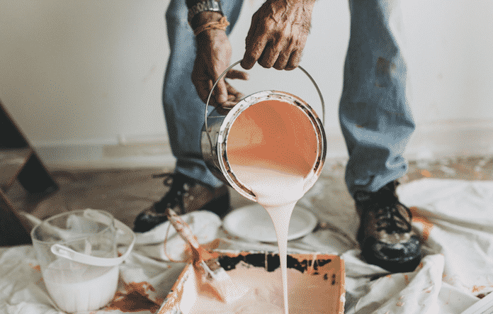 A painter working on a home for sale in Brisbane